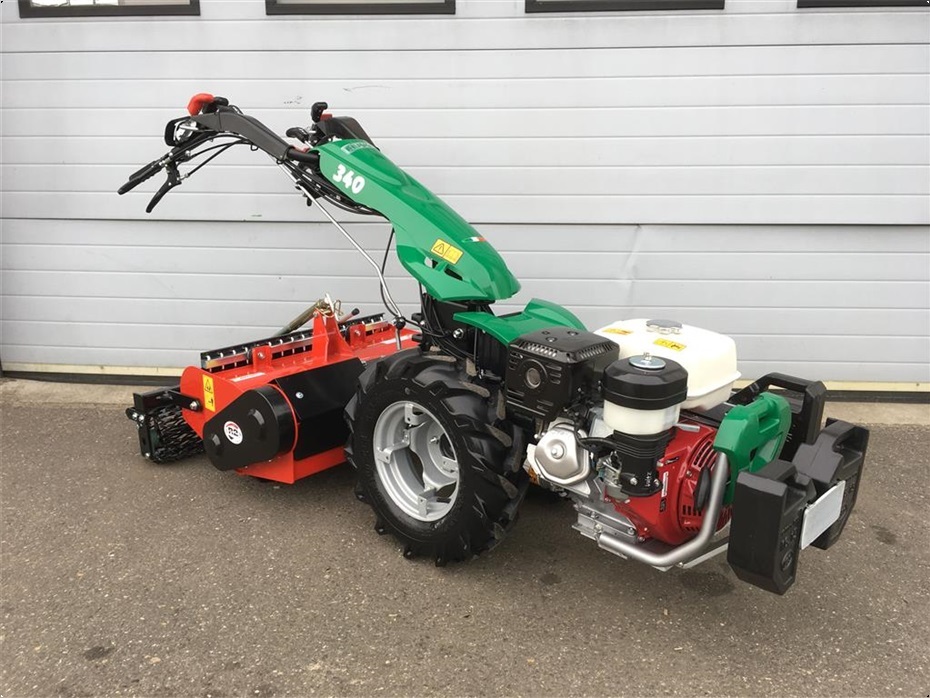 Eight shirts arranged on table in black, olive, grey, blue, white, red, mustard, and green.
